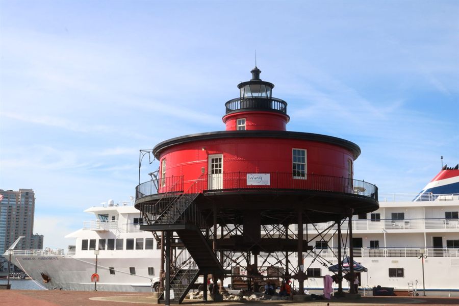 Red lighthouse at Baltimore’s Inner Harbor on a clear day