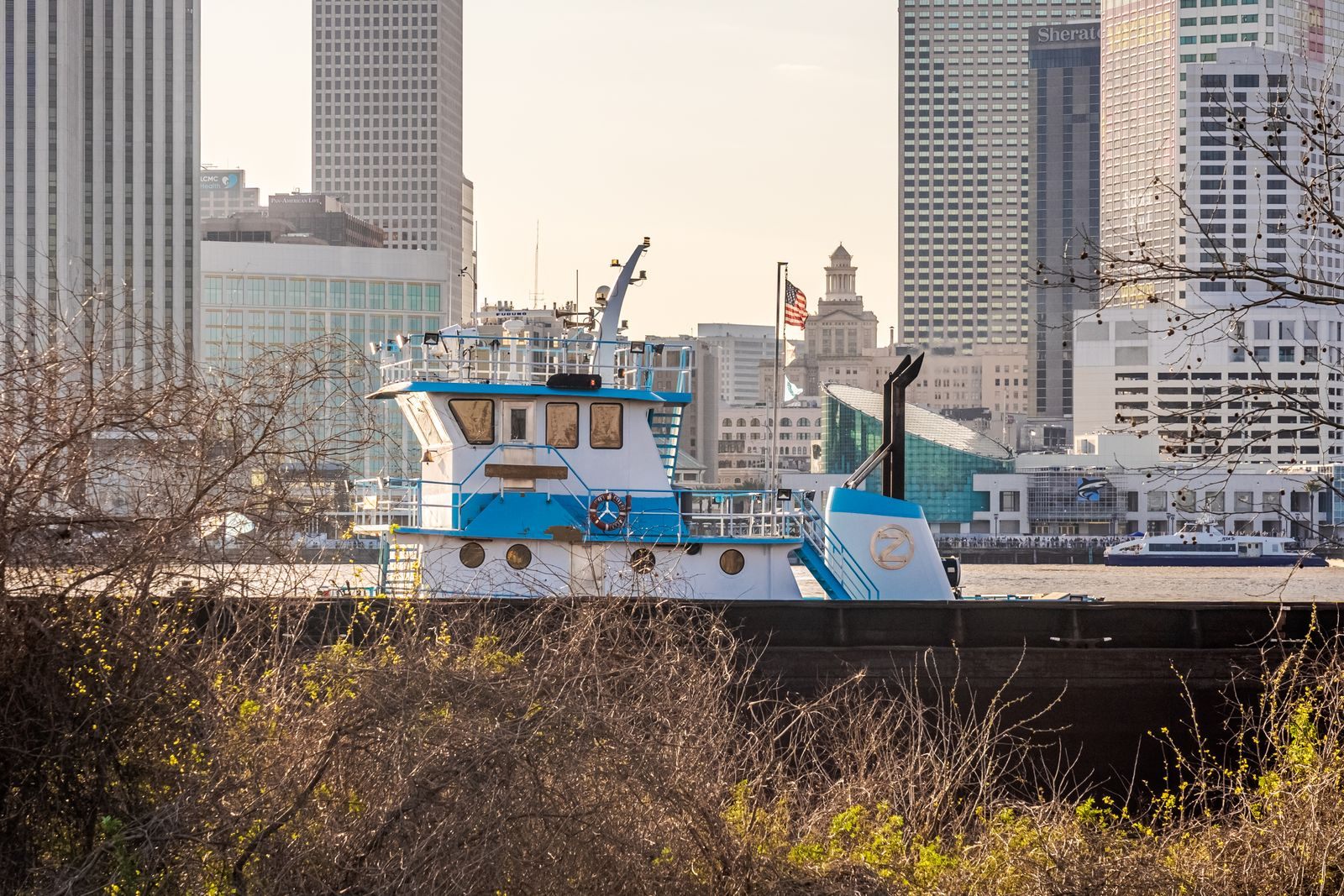 Tugboat on the Mississippi River with the New Orleans skyline behind